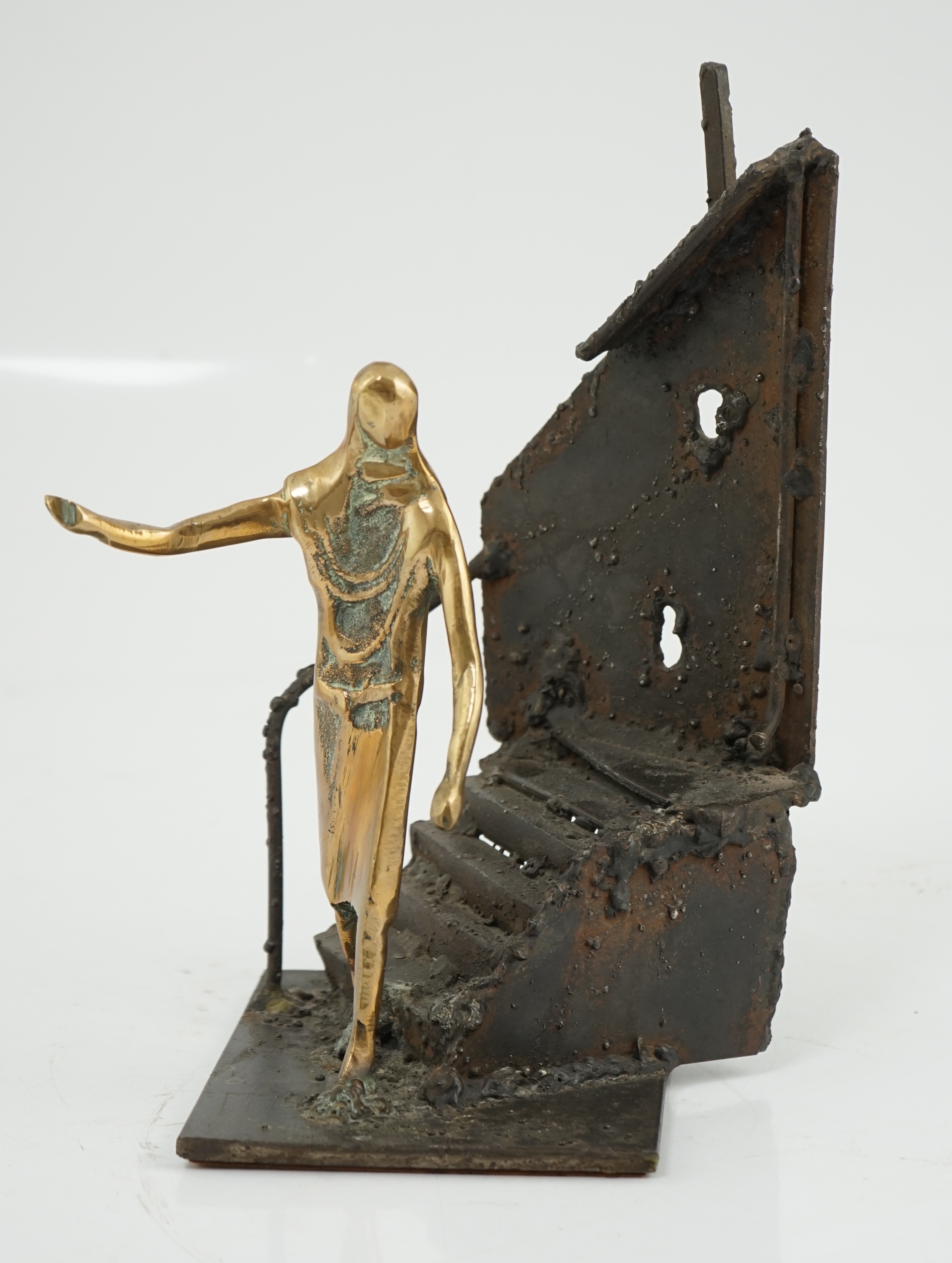 Arthur Dooley (British, 1929-1994), a bronze and iron group of a figure descending a staircase, 19cm wide, 29cm high